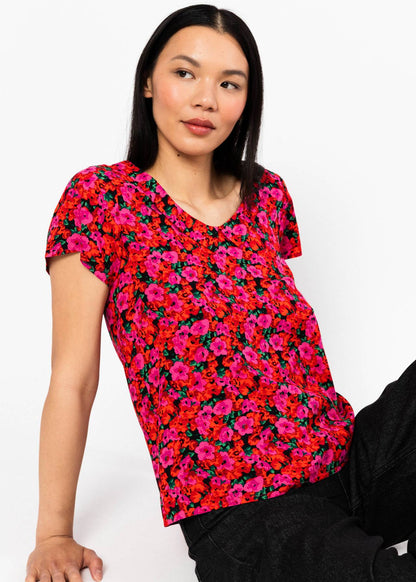 Summer blouse Feed the Birds bed of primroses