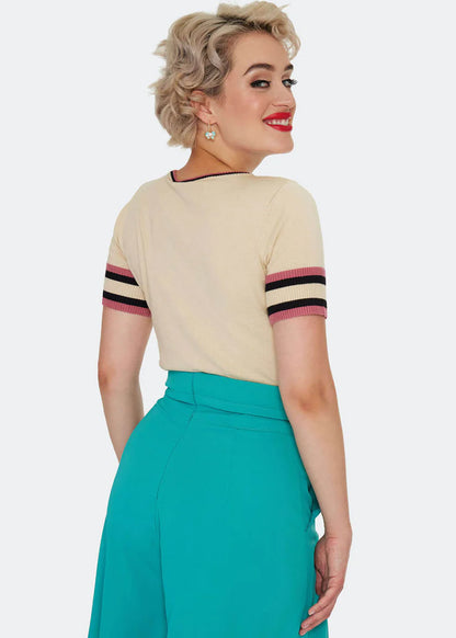 Cat asleep on a book sweater